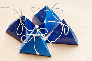 Image showing gift bags on a white wooden background