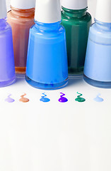 Image showing Bottles with spilled nail polish