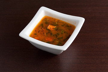 Image showing Chicken Soup on wooden table