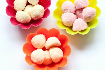 Image showing sweet jelly candies in cup cake cases on white