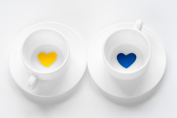 Image showing empty cup and saucer with hearts