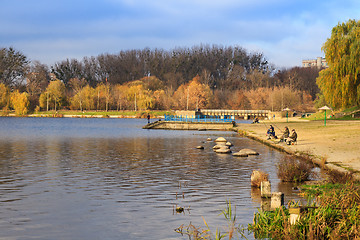 Image showing Catching of fish fishermen on a lake in autumn