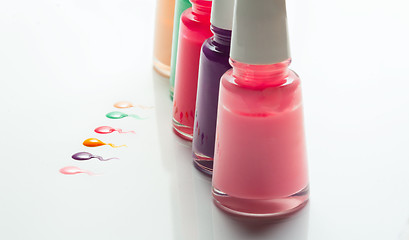 Image showing Bottles with spilled nail polish