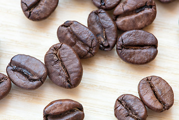 Image showing coffee beans on white wooden background