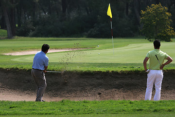 Image showing Golf swing in riva dei tessali golf course, italy