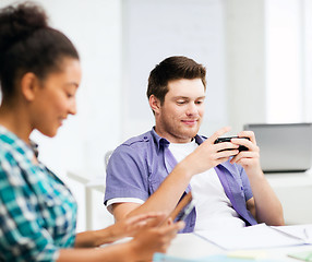 Image showing students looking at devices at school