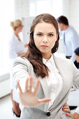 Image showing angry businesswoman showing stop gesture