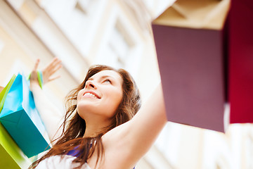 Image showing woman with shopping bags in ctiy