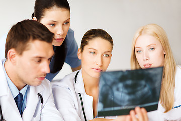 Image showing group of doctors looking at x-ray