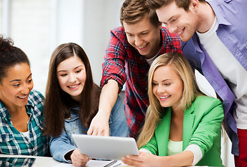 Image showing students looking at tablet pc in lecture at school