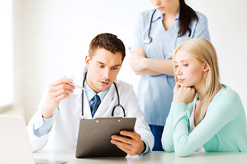 Image showing doctor and nurse with patient in hospital