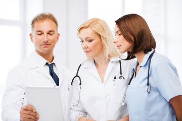 Image showing doctors looking at tablet pc