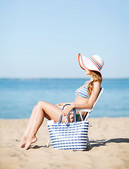 Image showing girl sunbathing on the beach chair