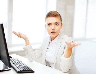 Image showing stressed businesswoman with computer