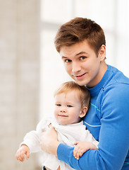 Image showing happy father with adorable baby