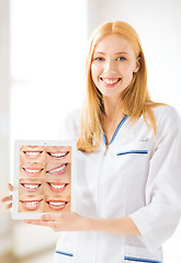 Image showing female doctor with tablet pc and smiles