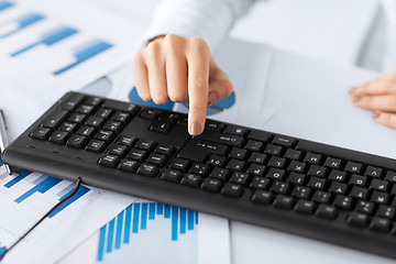 Image showing woman hand pressing enter button on keyboard