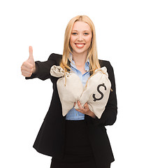 Image showing businesswoman with money bags showing thumbs up