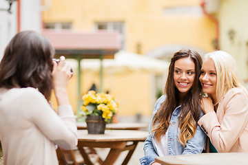 Image showing beautiful girls taking picture in cafe in city