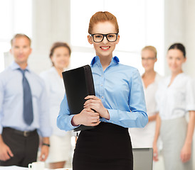 Image showing businesswoman with tablet pc in office