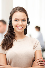 Image showing helpline operator with headphones in call centre