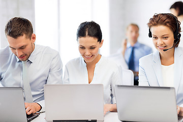 Image showing group of people working with laptops in office