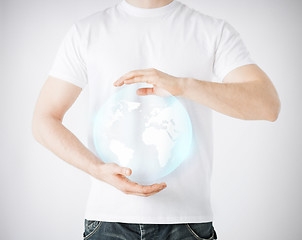 Image showing man hands holding sphere globe