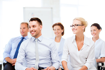 Image showing businessmen and businesswomen on conference