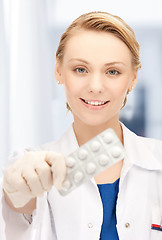 Image showing doctor with blister pack of pills