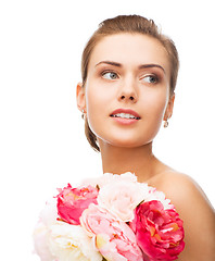 Image showing woman with diamond earrings and flowers