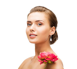 Image showing woman wearing earrings with flower