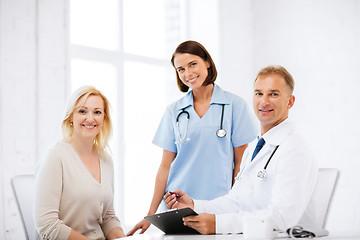 Image showing doctor and nurse with patient in hospital