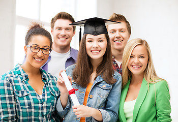 Image showing girl in graduation cap with certificate