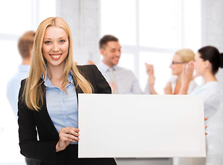 Image showing businesswoman with white blank board