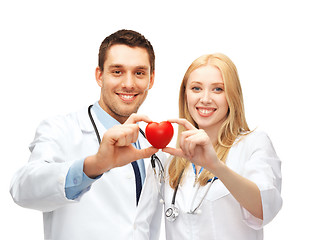 Image showing doctors cardiologists with heart