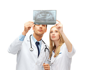 Image showing two doctors dentists looking at x-ray