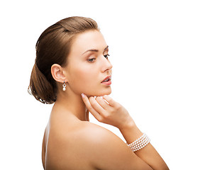 Image showing beautiful woman with pearl earrings and bracelet