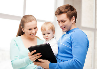 Image showing parents and adorable baby with tablet pc