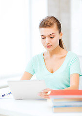 Image showing smiling student girl with tablet pc