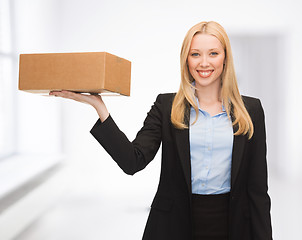 Image showing businesswoman delivering cardboard box