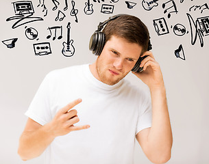 Image showing man with headphones listening rock music