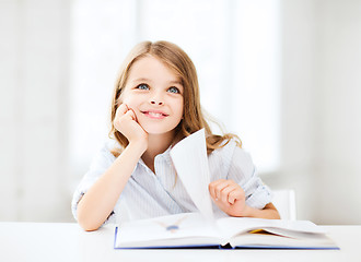 Image showing little student girl studying at school