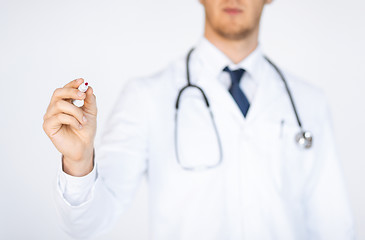 Image showing doctor writing something in the air