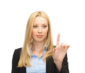 Image showing businesswoman working with something imaginary