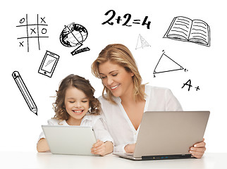 Image showing girl and mother with tablet and laptop