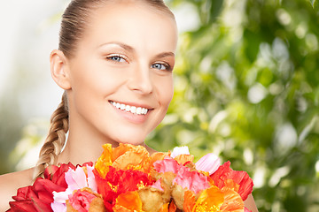 Image showing young woman with bouquet of flowers