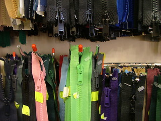 Image showing zippers hanging