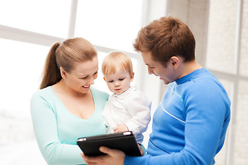 Image showing parents and adorable baby with tablet pc