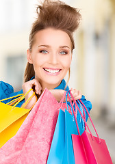 Image showing woman with shopping bags in ctiy