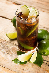 Image showing cocktail with cola ice cubes and lime